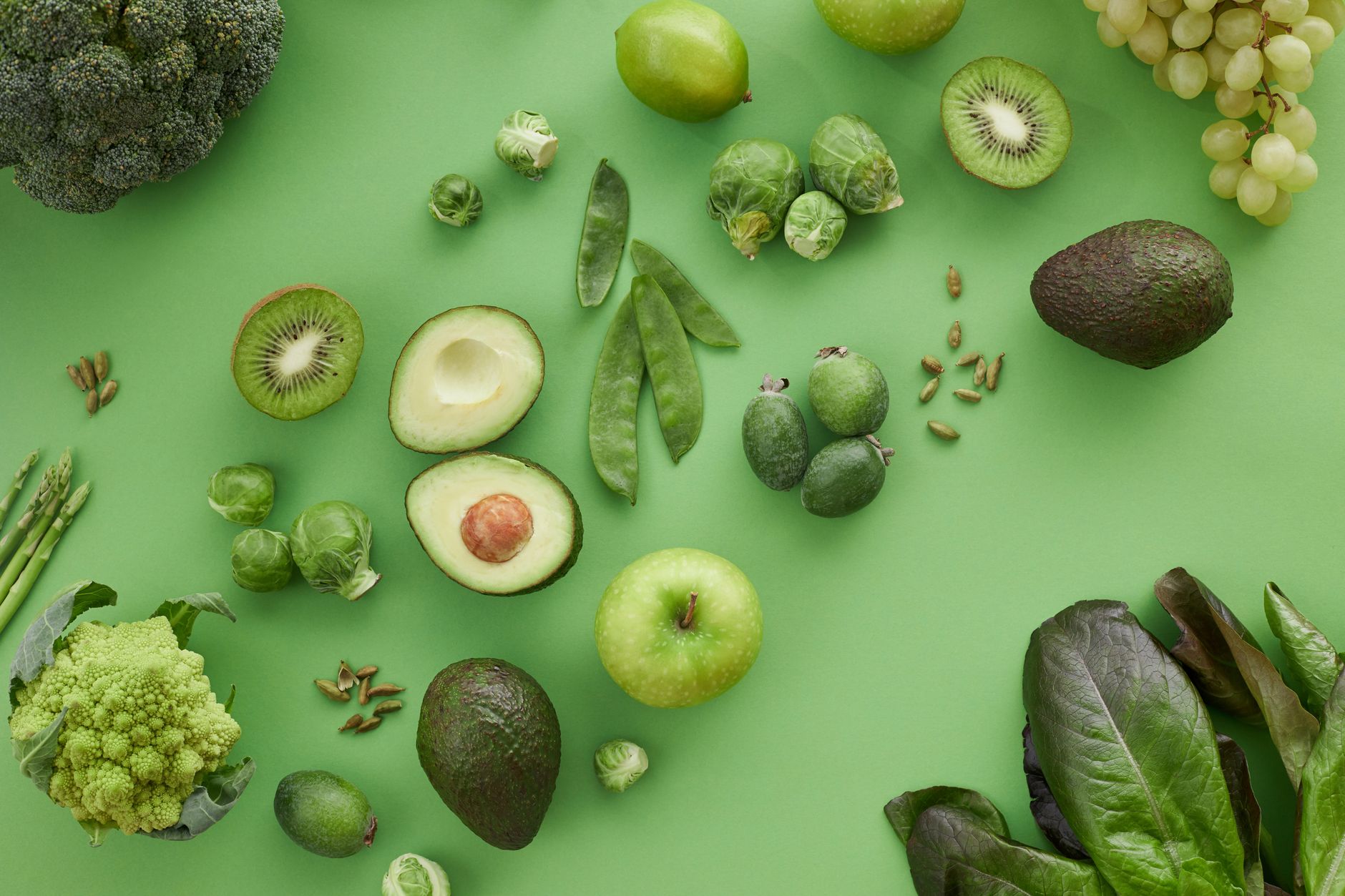 A variety of fresh green fruits and vegetables on a matching background, showcasing healthy organ... (Photo by Vanessa Loring on Pexels)